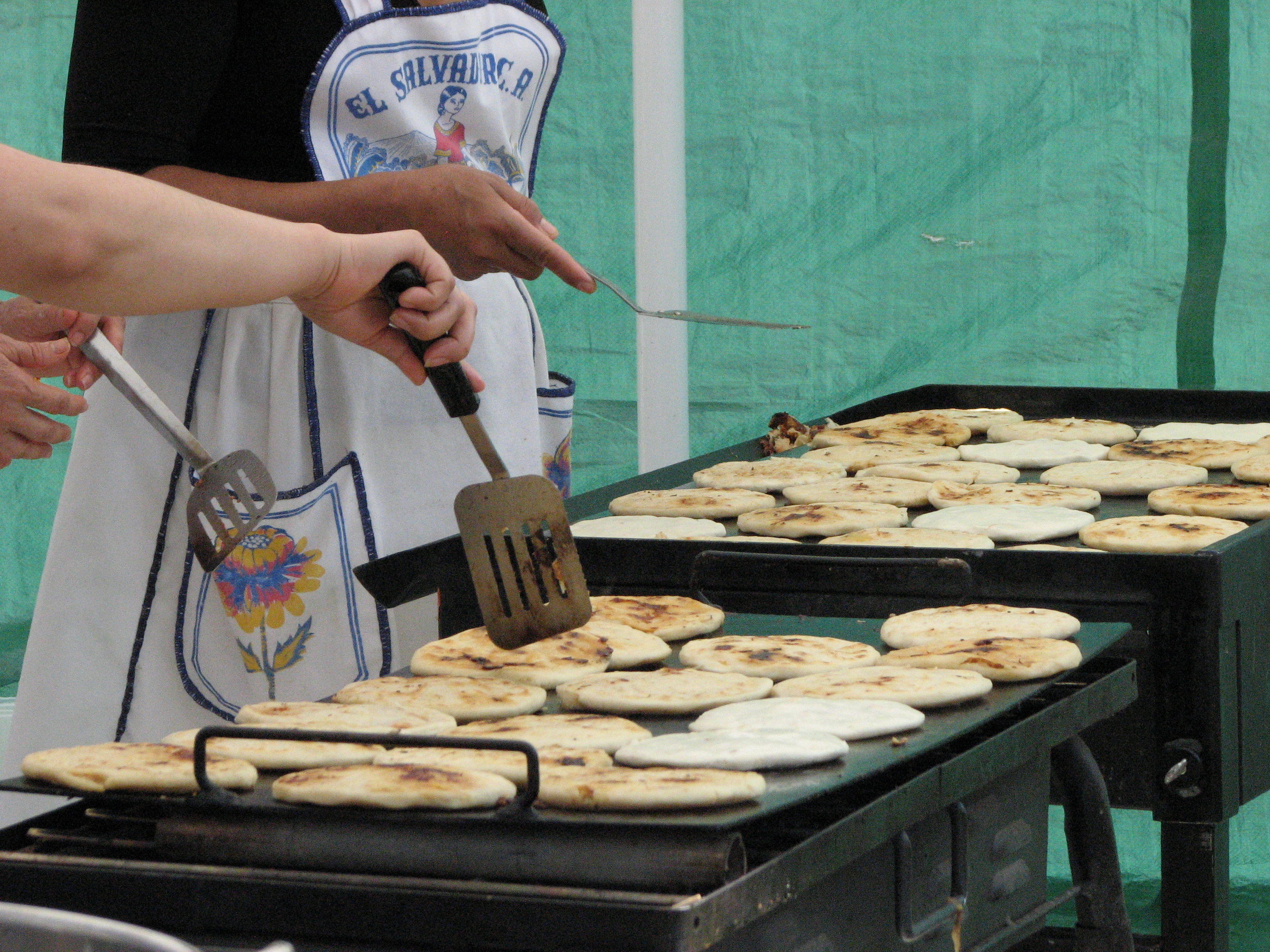 Making pupusas, a popular dish in El Salvador and Honduras, at Edmonton Latin Festival in 2009.