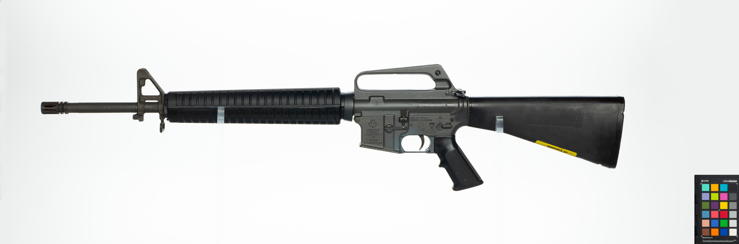 C7 Rifle A black rifle with a fixed stock and carry handle.