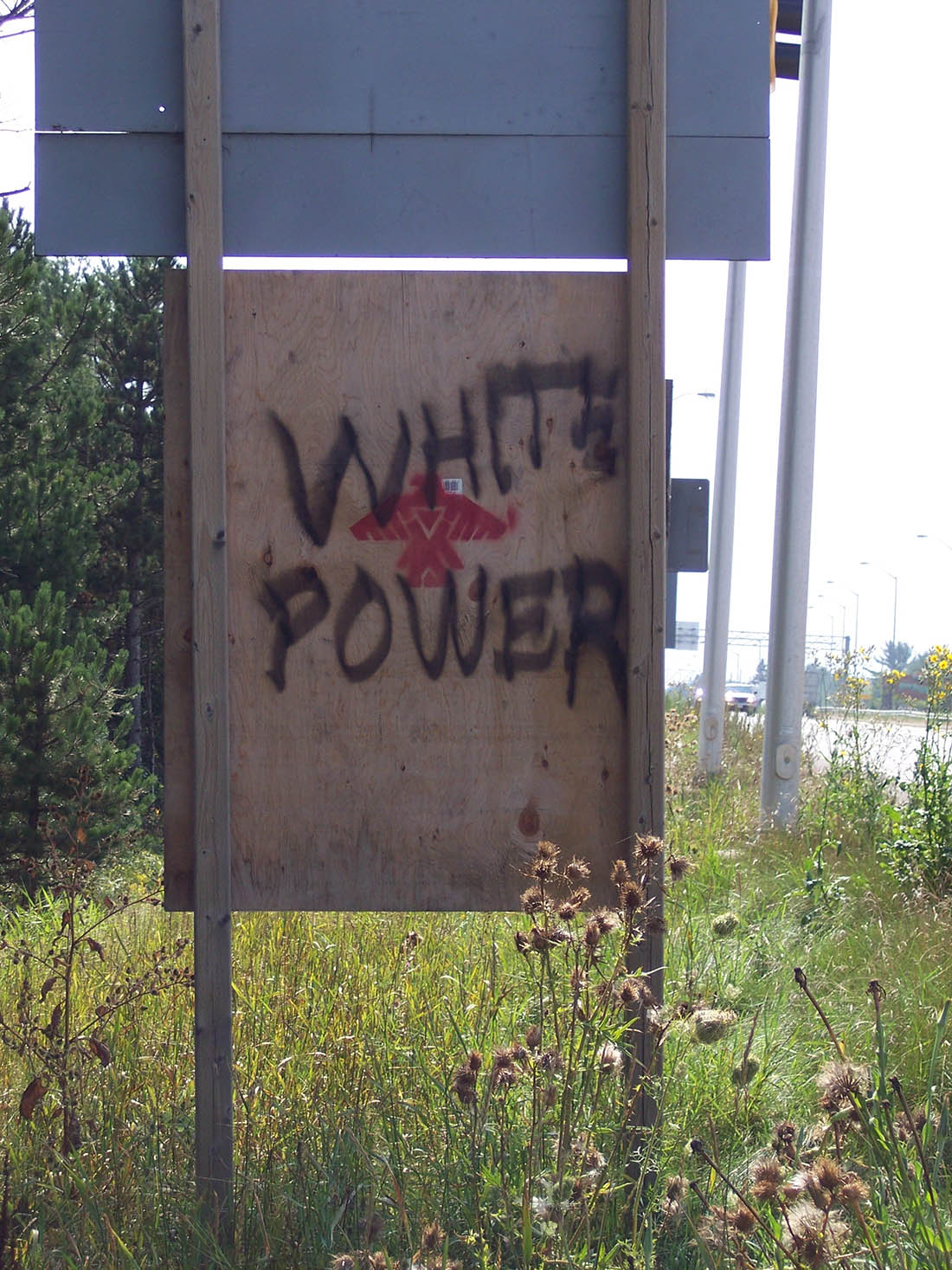 Vandalism on the back of the Toll Booth Public Notice Sign