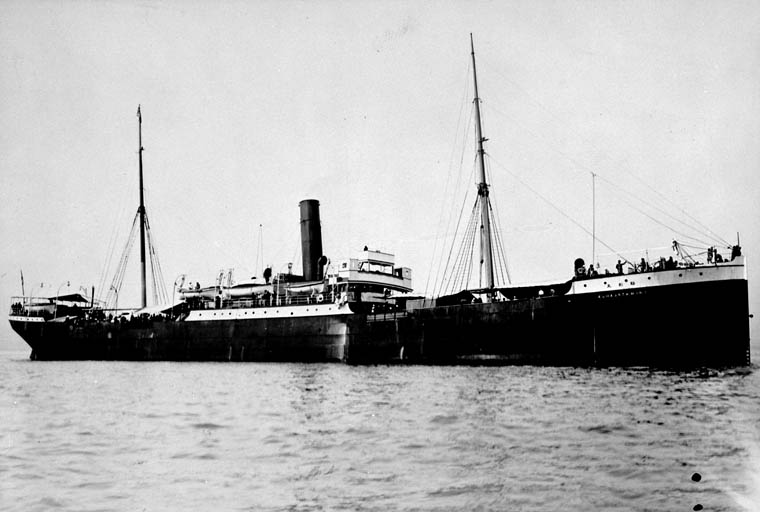 <p>The <em>Komagata Maru</em> (<em>Guru Nanak Jahaz</em>), Vancouver 1914</p> A black and white photograph of a ship with a single large chimney.