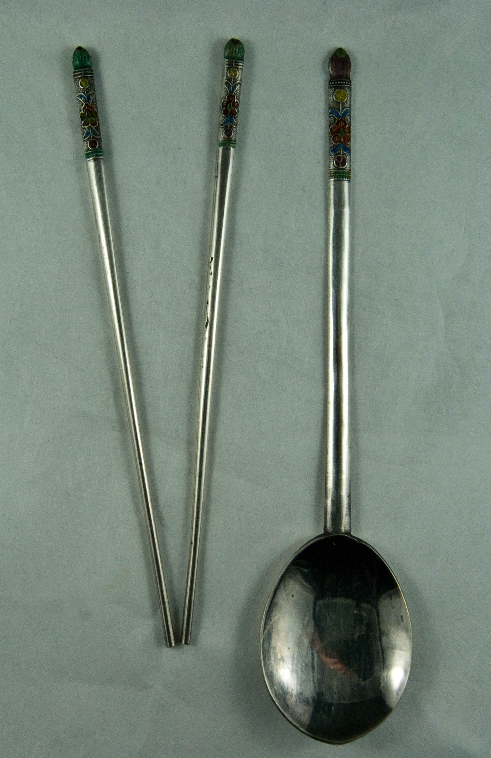 Silver chopsticks and soup spoon presented to Lt. Fred Joyce by Korean village elders as a good-will gesture, 1954.