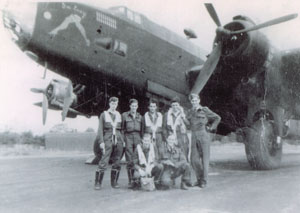 Mr. Cowhey and his crew standing in front of their Halifax Mark 7. Most of them, including Mr. Cowhey (far left) are wearing their Mae West life jackets. The crew flew as part of 426 Squadron.