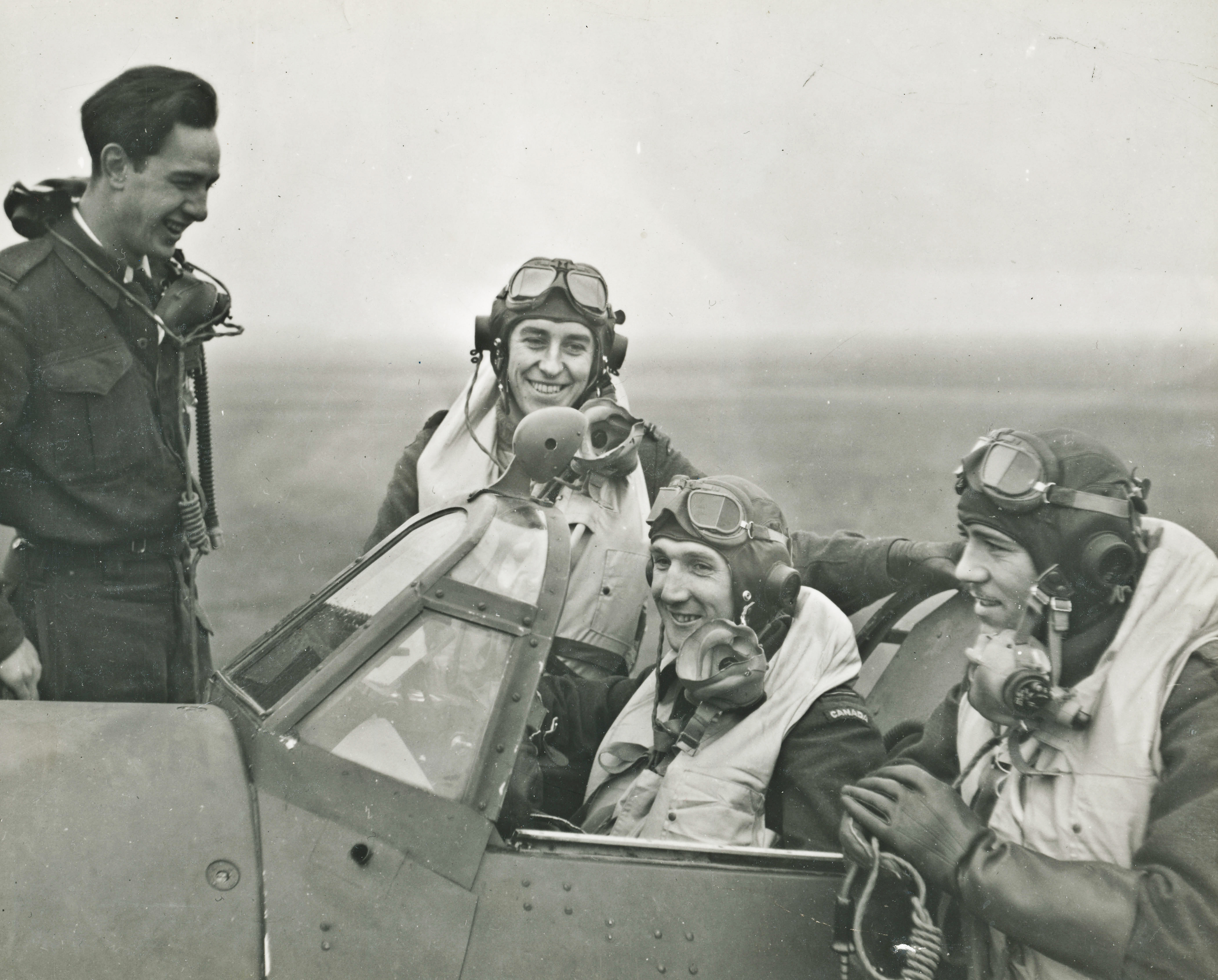 Photo taken at AUX Airfield at Wellingore, England, 1942. Jack Hilton is in the cockpit of the Hurricane Aircraft, part of 438 Fighter Squadron.