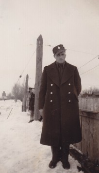 Leonard Link at Skating Rink, in town of Maple Creek, Saskatchewan, Winter of 1942. Kids from the town can be seen in the background.