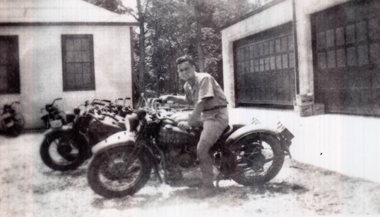 Marcel Caron on with his motorcycle, Kingston, Ontario, 1941.