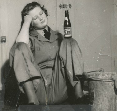 Patricia Collins (née Holden) resting after cleaning up in the darkroom.