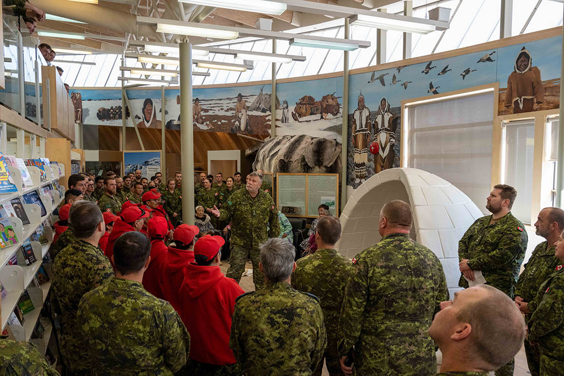Canadian Armed Forces Members gather in a community centre