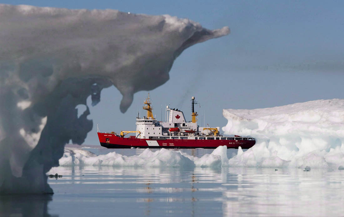 Canadian Coast Guard Medium Icebreaker Henry Larsen floats behind ice