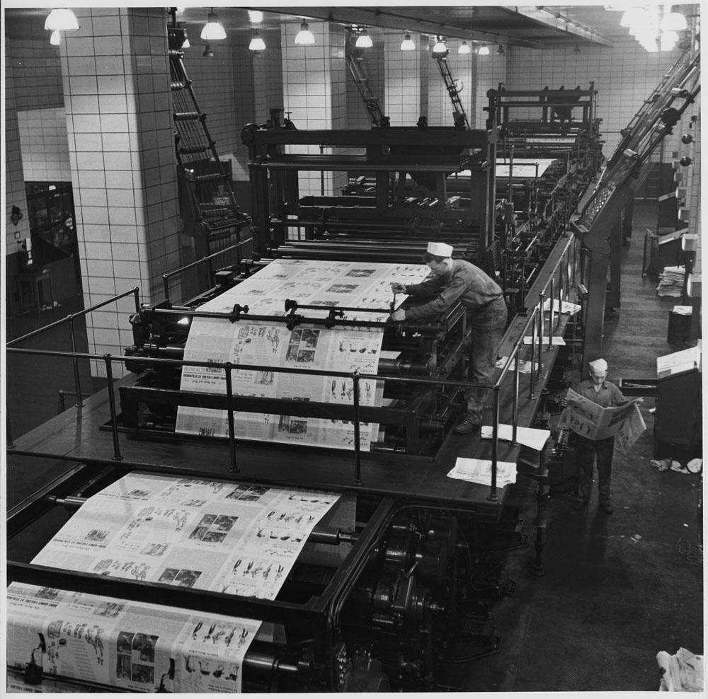 Newspaper Printing Room Globe and Mail workers in the newspaper printing room in Toronto, Ontario c. 1939-51