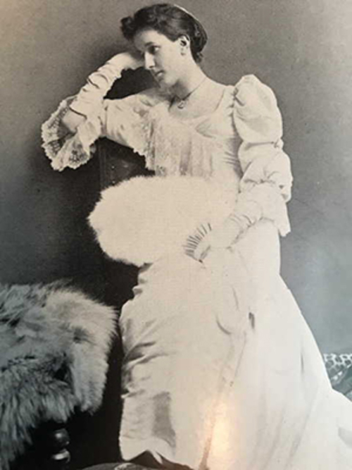 Mary Edith Tyrrell in a white dress.