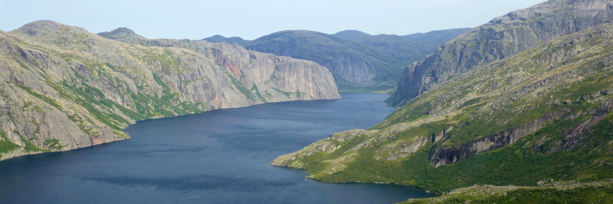 Lake surrounded by rocky mountains.