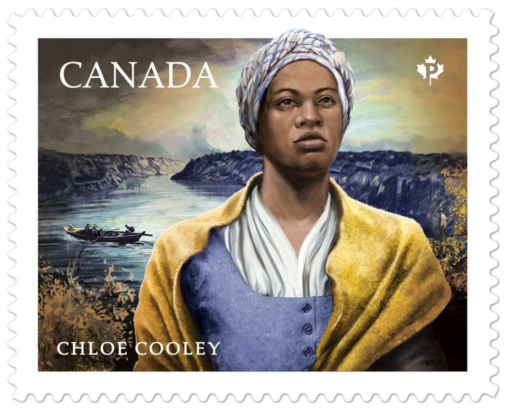 A Black Woman, behind her is a river with a boat and cliffs.