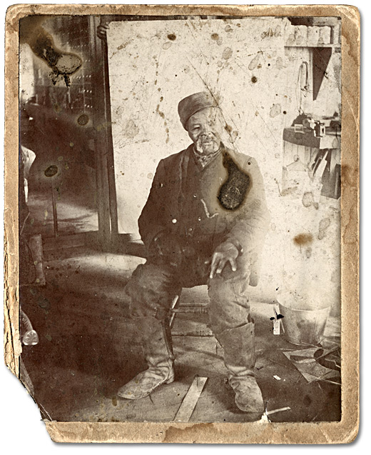 Levi Veney inside J.D. Burkes' store in Amherstburg, ON, 1898.