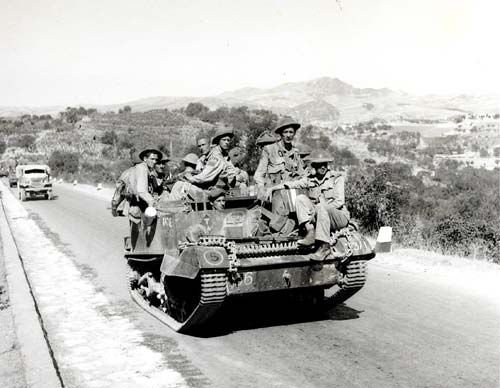 Canadian troops with the Hastings and Prince Edward Regiment in an armoured carrier, advancing north through Italy in July 1943.