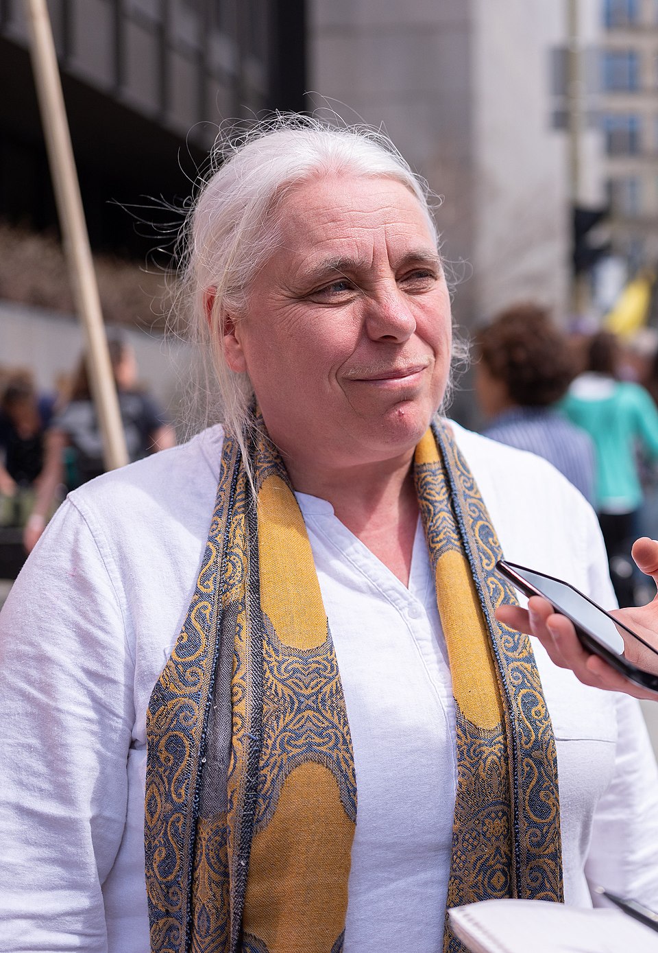 Manon Massé with a scarf and a white shirt.