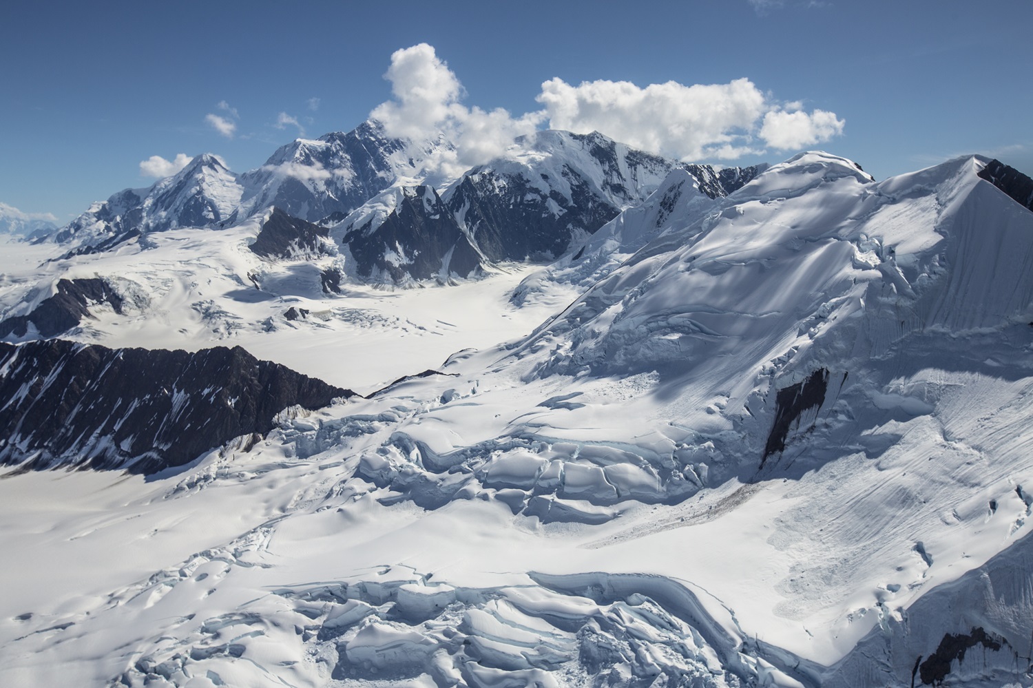 Head of Columbus Glacier and Mount St. Elias Tall, snowy mountains.
