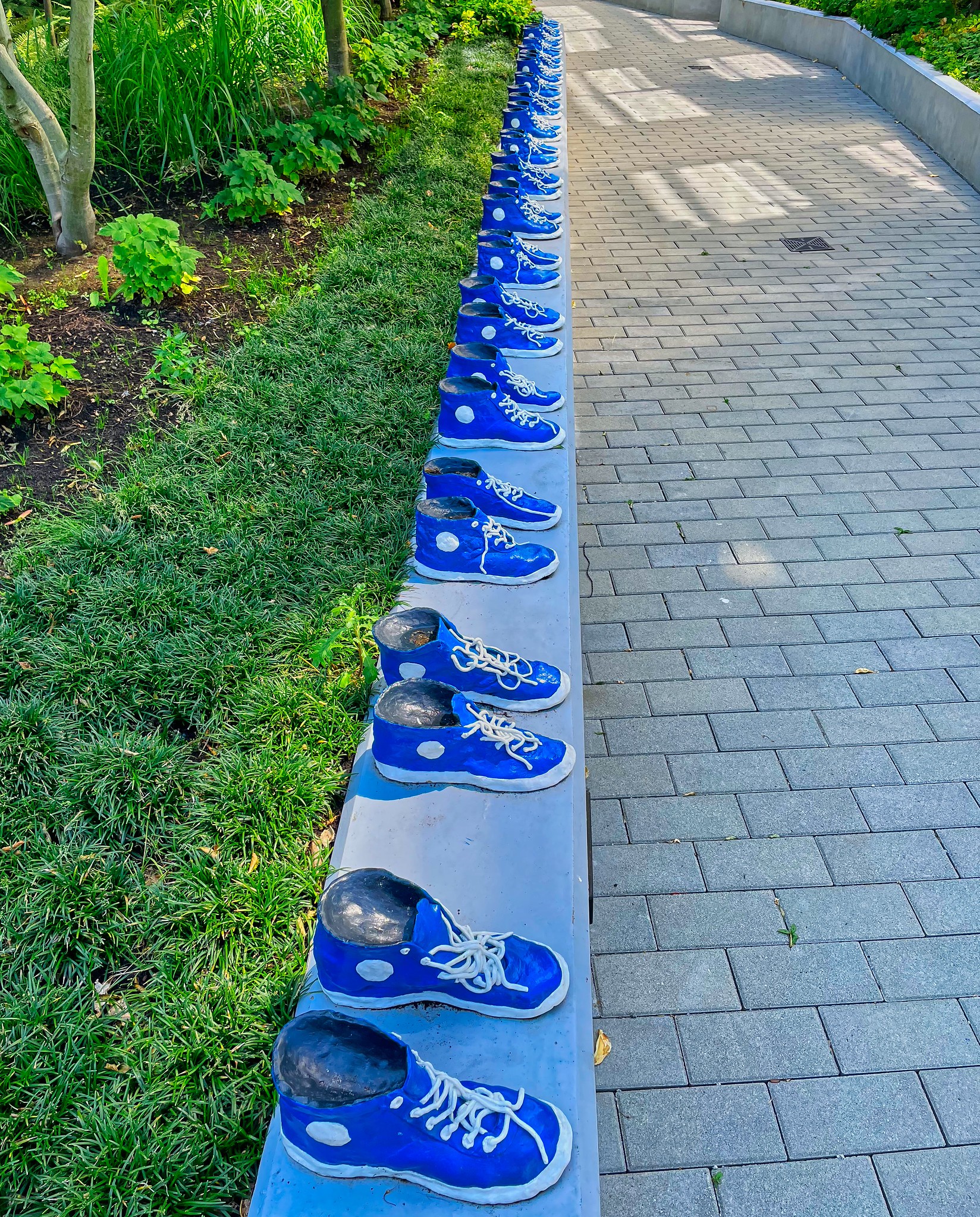 <i>18 Pairs of Blue and White Running Shoes</i> by Gathie Falk, Vancouver